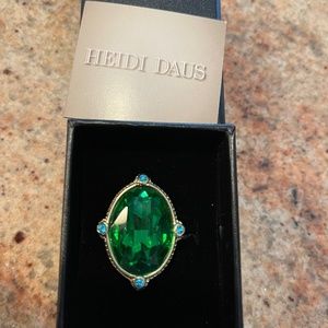 Heidi Daus ring  never worn green stone size 7.  In original box